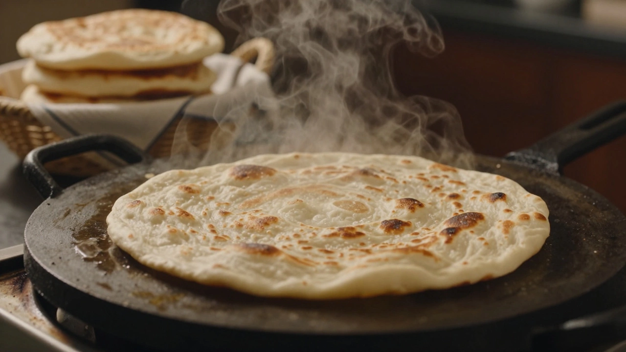 Roti puffing up on a hot cast iron griddle with steam rising.
