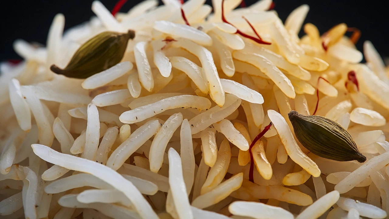 Close-up of fluffy, separate biryani rice grains with saffron and cardamom